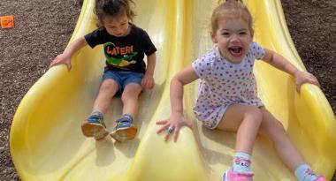Preschool Kids looking happy in a slide